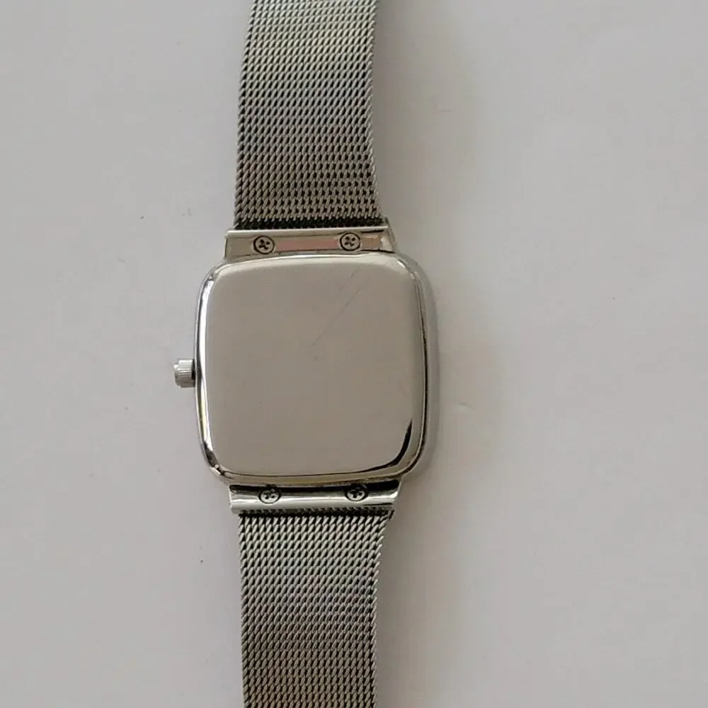 Skagen Womens Watch White Dial Silver Case Gold Bezel Mesh Bracelet Stainless